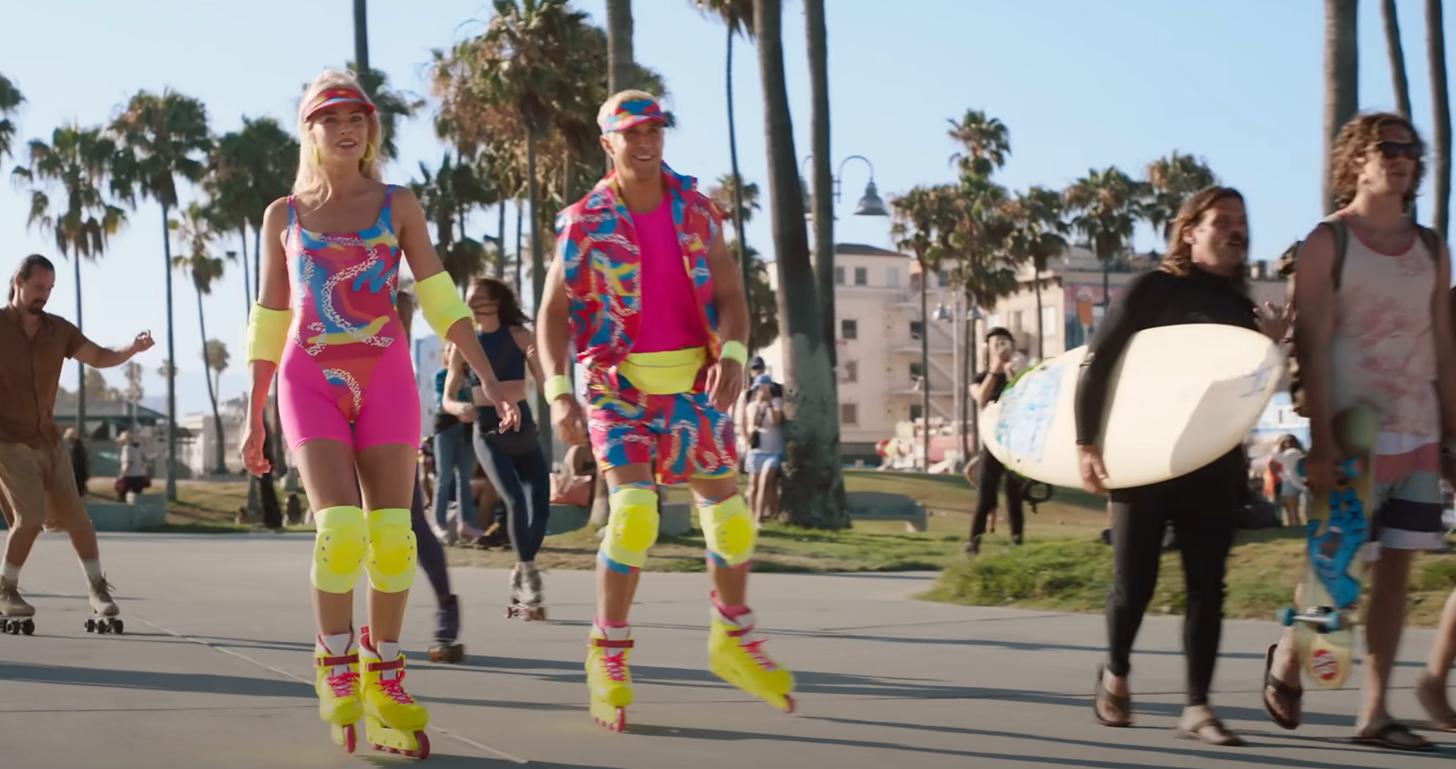 Still image from Barbie movie featuring Barbie and Ken rollerskating
