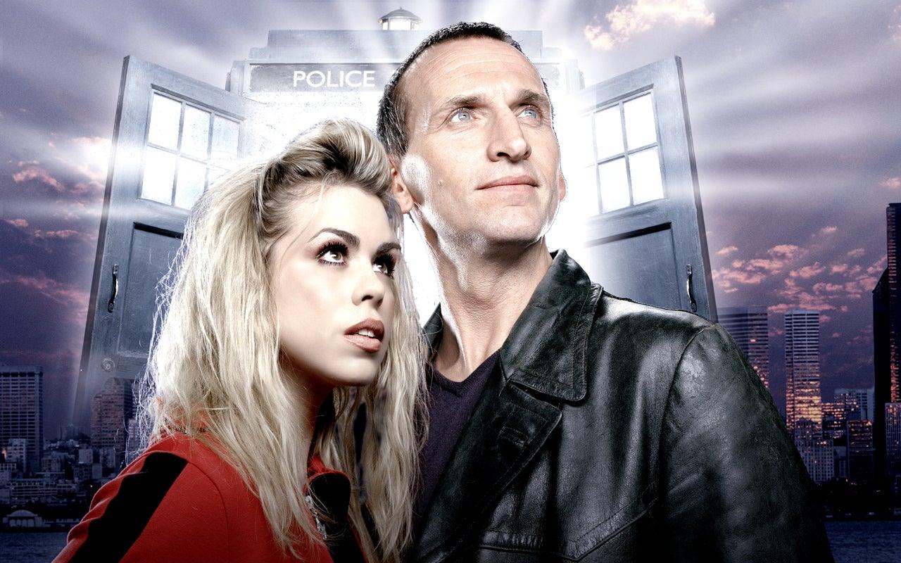 Press image of Billie Piper and Christopher Eccleston in costume with the TARDIS behind them