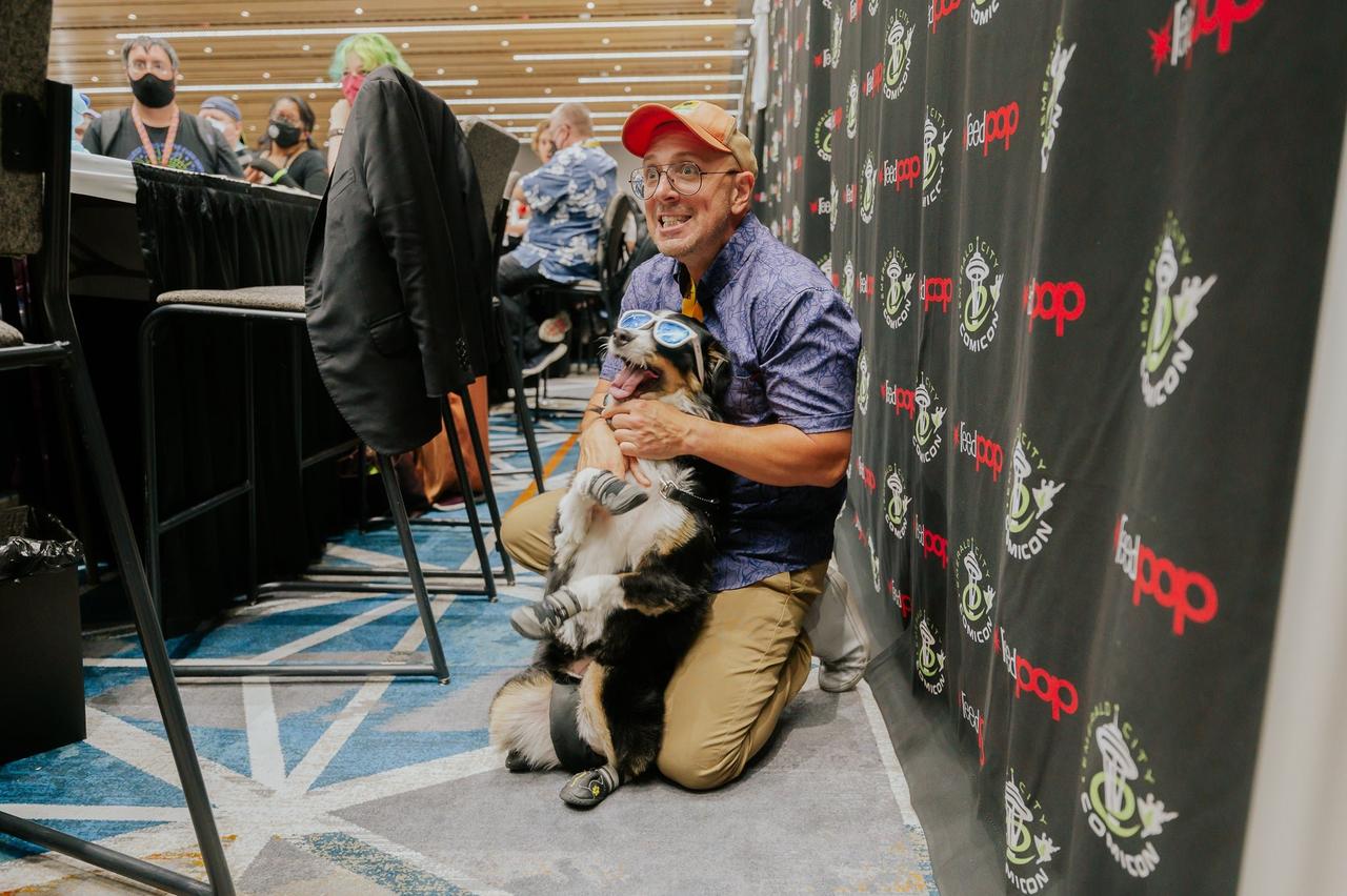 Steve Burns playing with a dog at ECCC