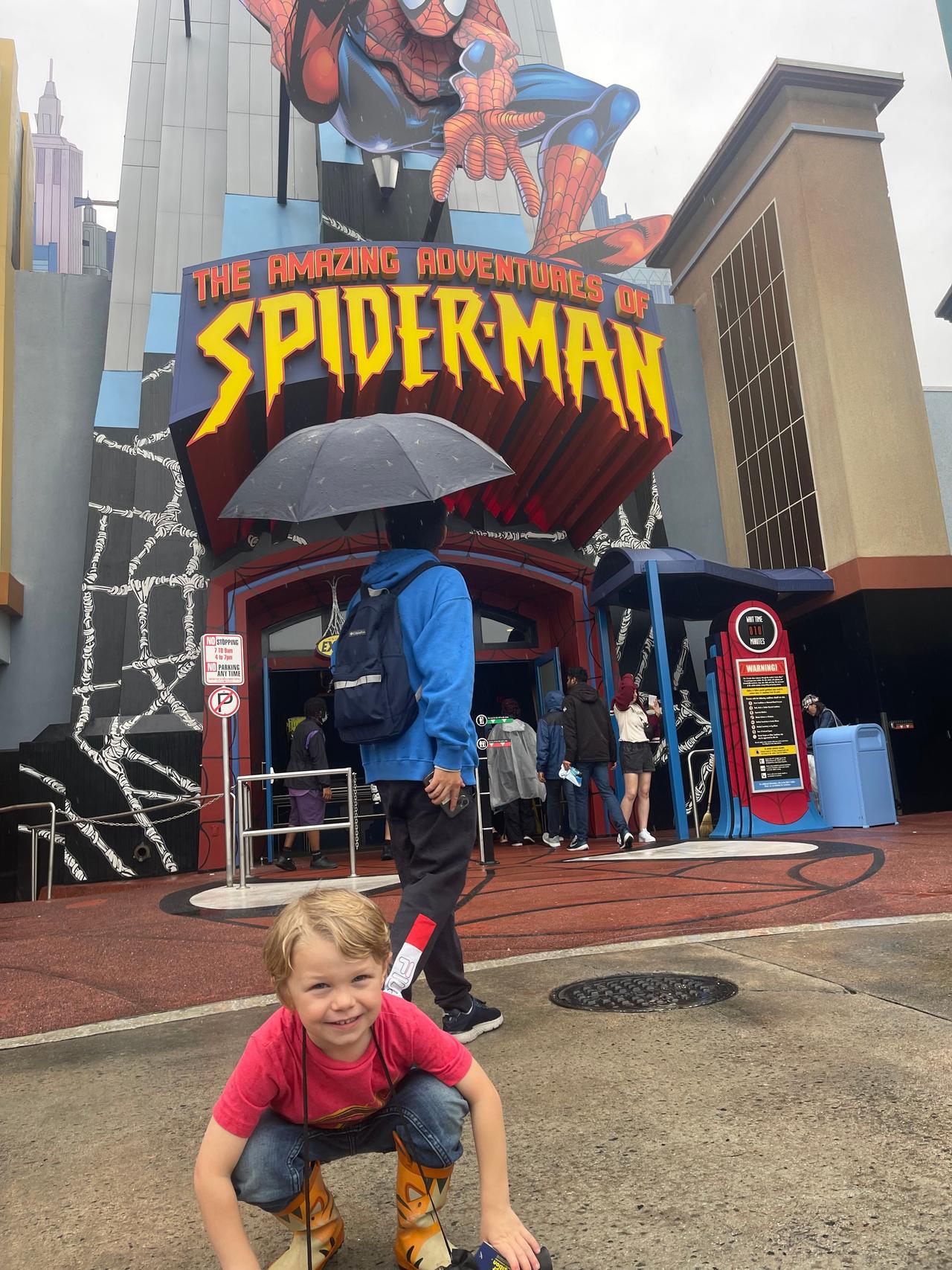 Toddler outside Universal's Spider-Man ride