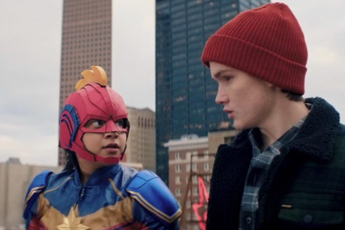 Ms Marvel trailer Iman Vellani as Kamala Khan in a Blue, Red, and Gold Ms Marvel costume facing Matt Lintz as Bruno Carrelli