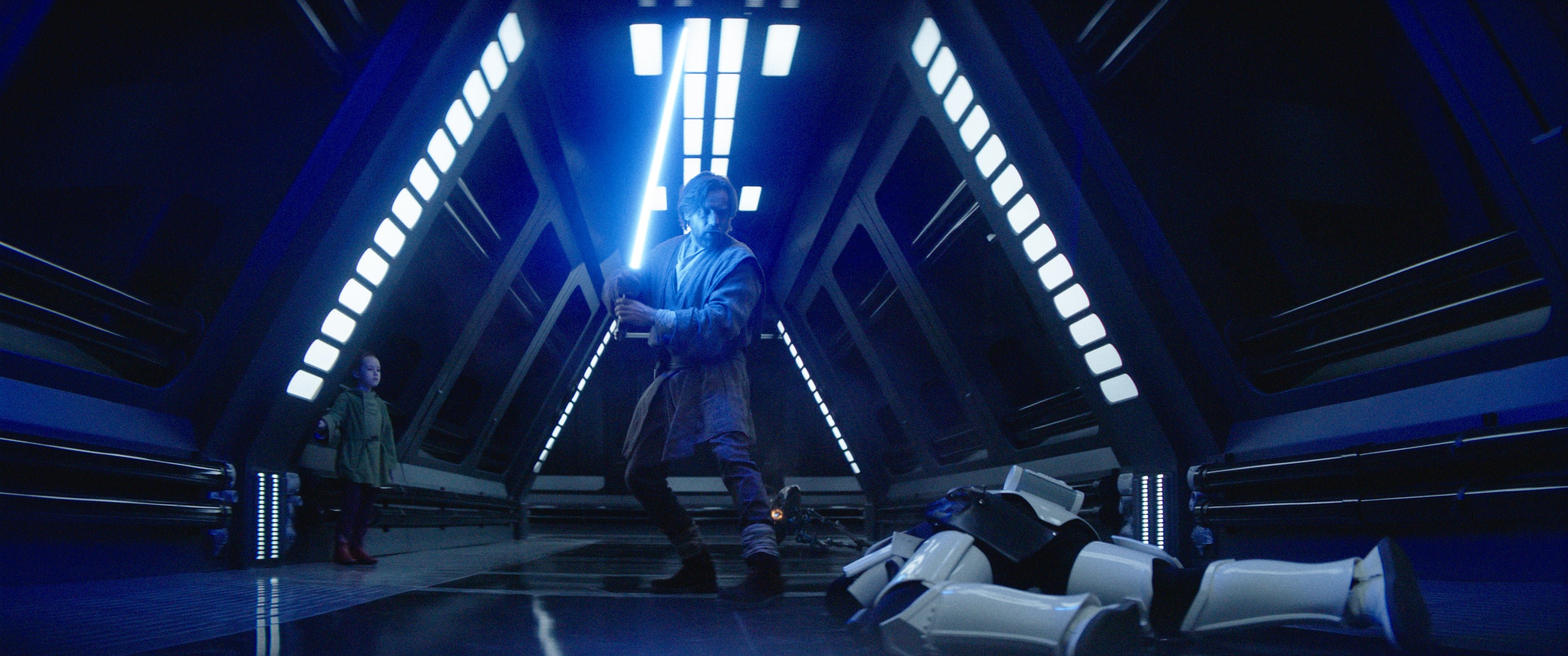 Image of Ewan Mcgregor as Obi Wan Kenobi holding up his lightsaber
