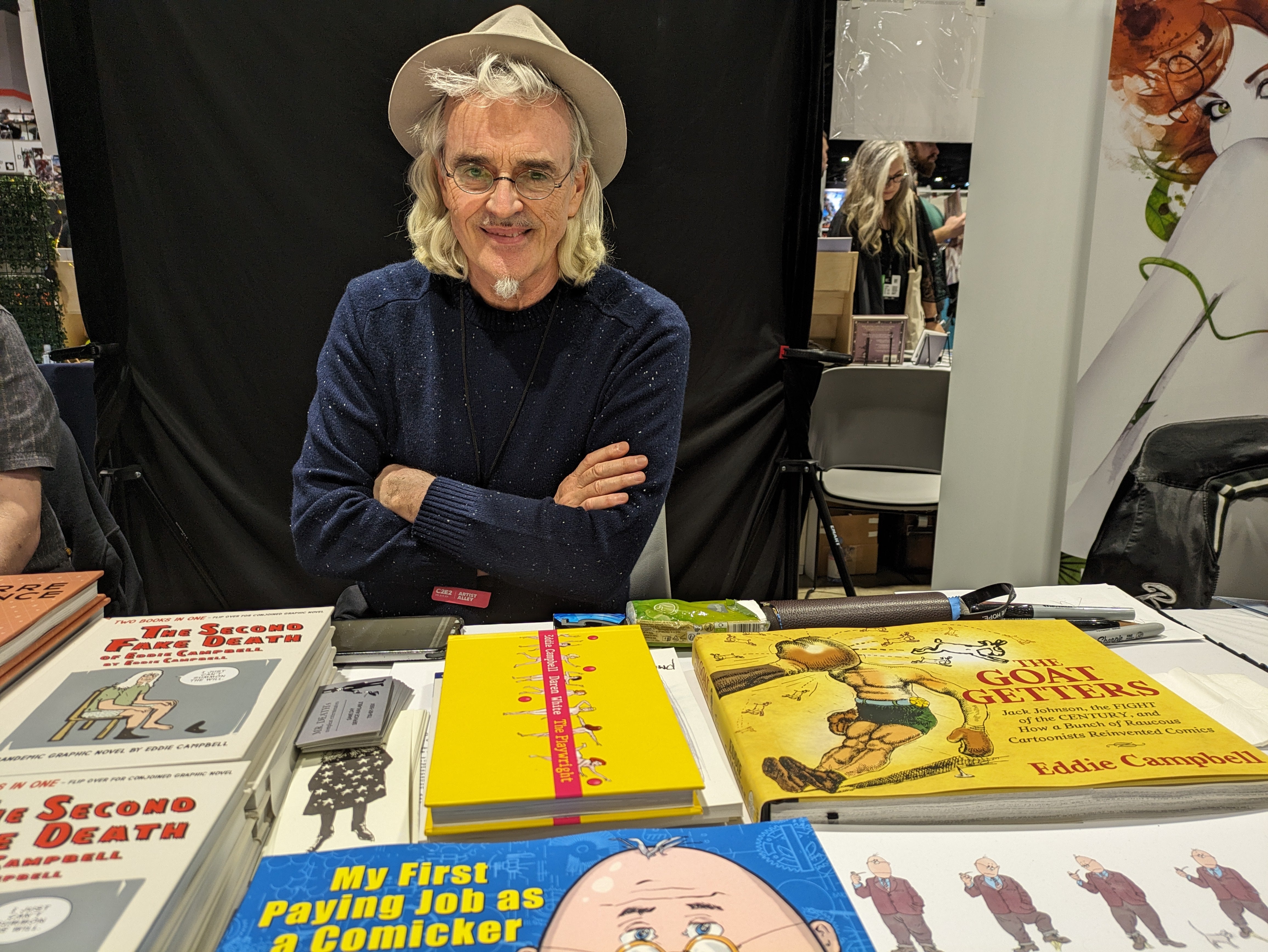 Photograph of Eddie Campbell at his convention booth