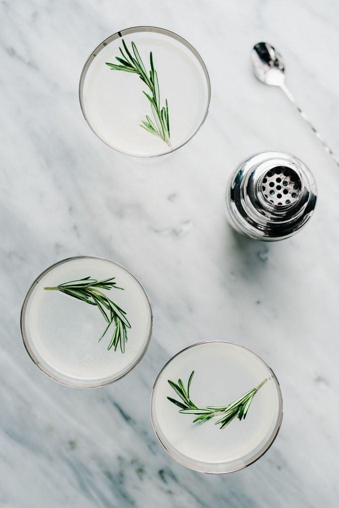 Birds eye view of three rosemary vodka gimlets