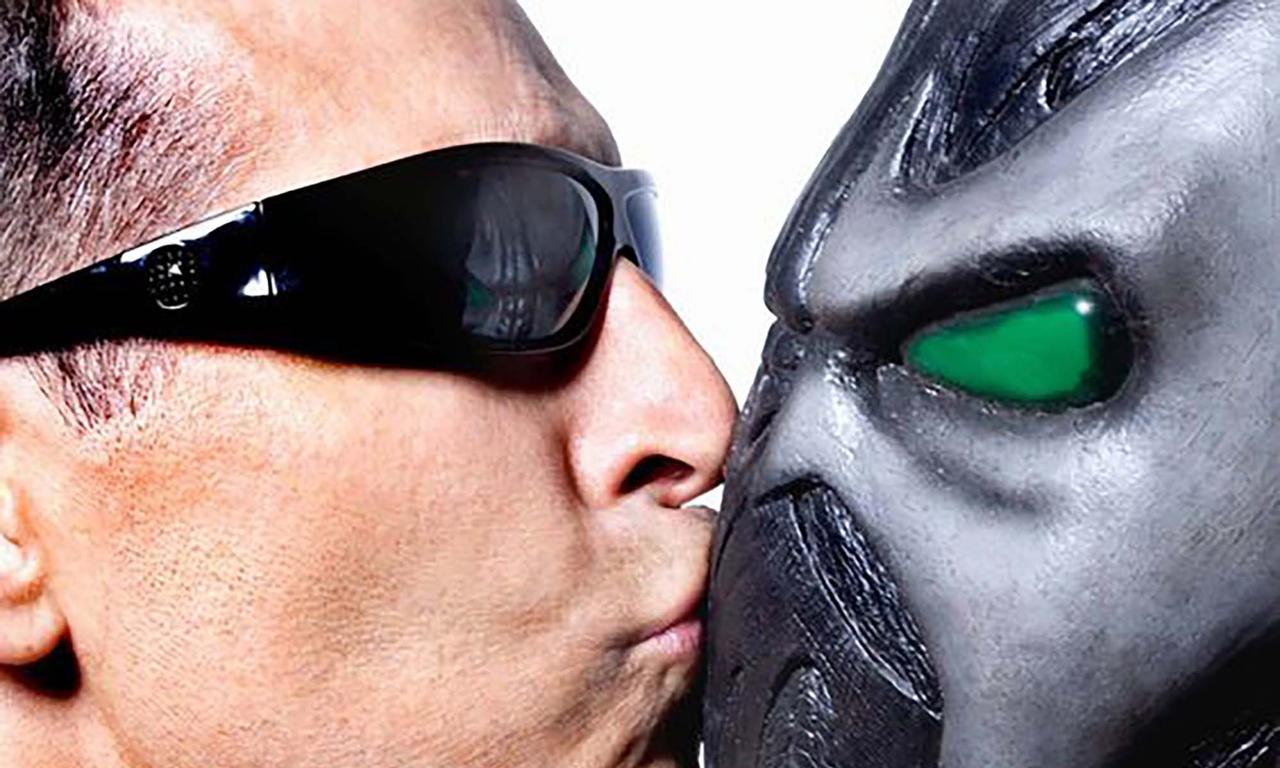 Todd McFarlane kissing a Spawn mask