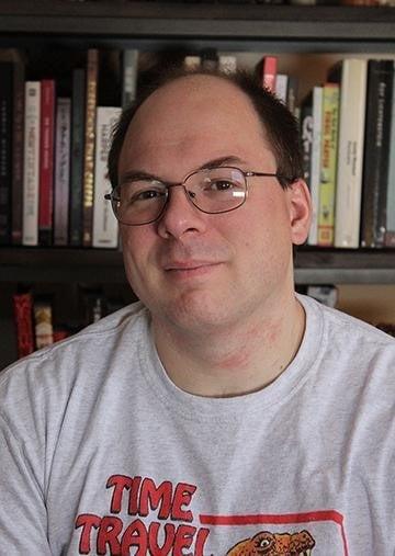 Image of Steve Steiner in front of a bookcase