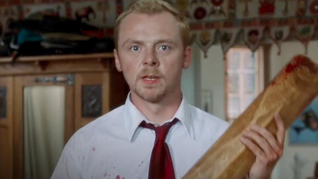 A still from Shaun of the Dead of Simon Pegg holding a cricket bat